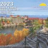 2023 Hudson valley Weather Calendar Cover. There's a small lake with a picturesque hotel around it in the fall.