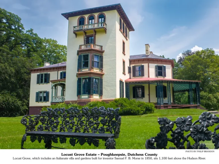 August 2026 calendar picture | a large old home with 3 stories and wrap around deck.