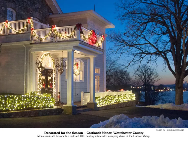 December 2025 calendar picture | Christmas lights on a white entranceway.