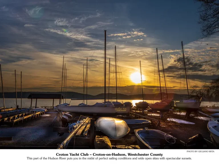 March 2026 calendar picture | sunset over the river and boat yard.