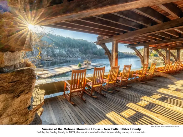 November 2026 calendar picture | rocking chairs on a deck overlooking a lake.