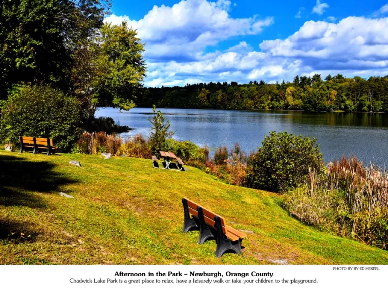 September 2026 calendar picture | park benches along the shore of a lake.